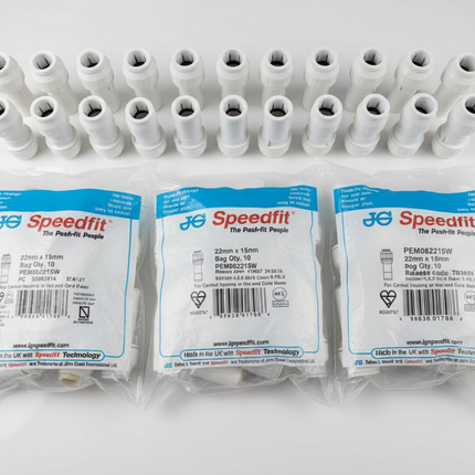 Plastic connectors with Speedfit packaging on a white surface