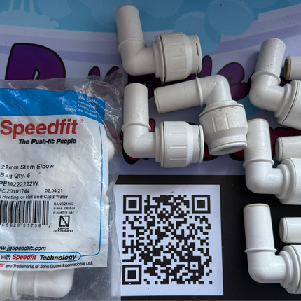 Plumbing fittings with Speedfit packaging on a white background