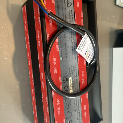 Electrical component with wires on a red and black box