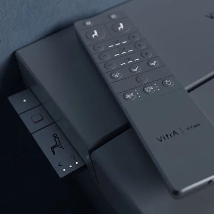 Control panel with buttons and 'Vitra' branding on a dark background